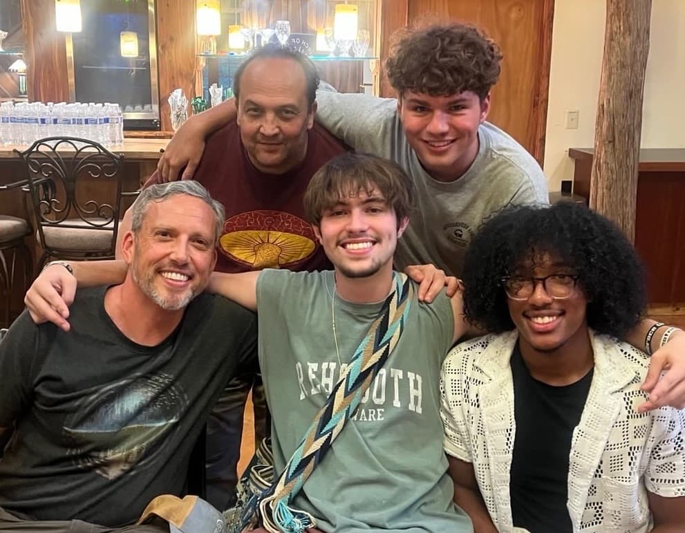 Group of five posing indoors