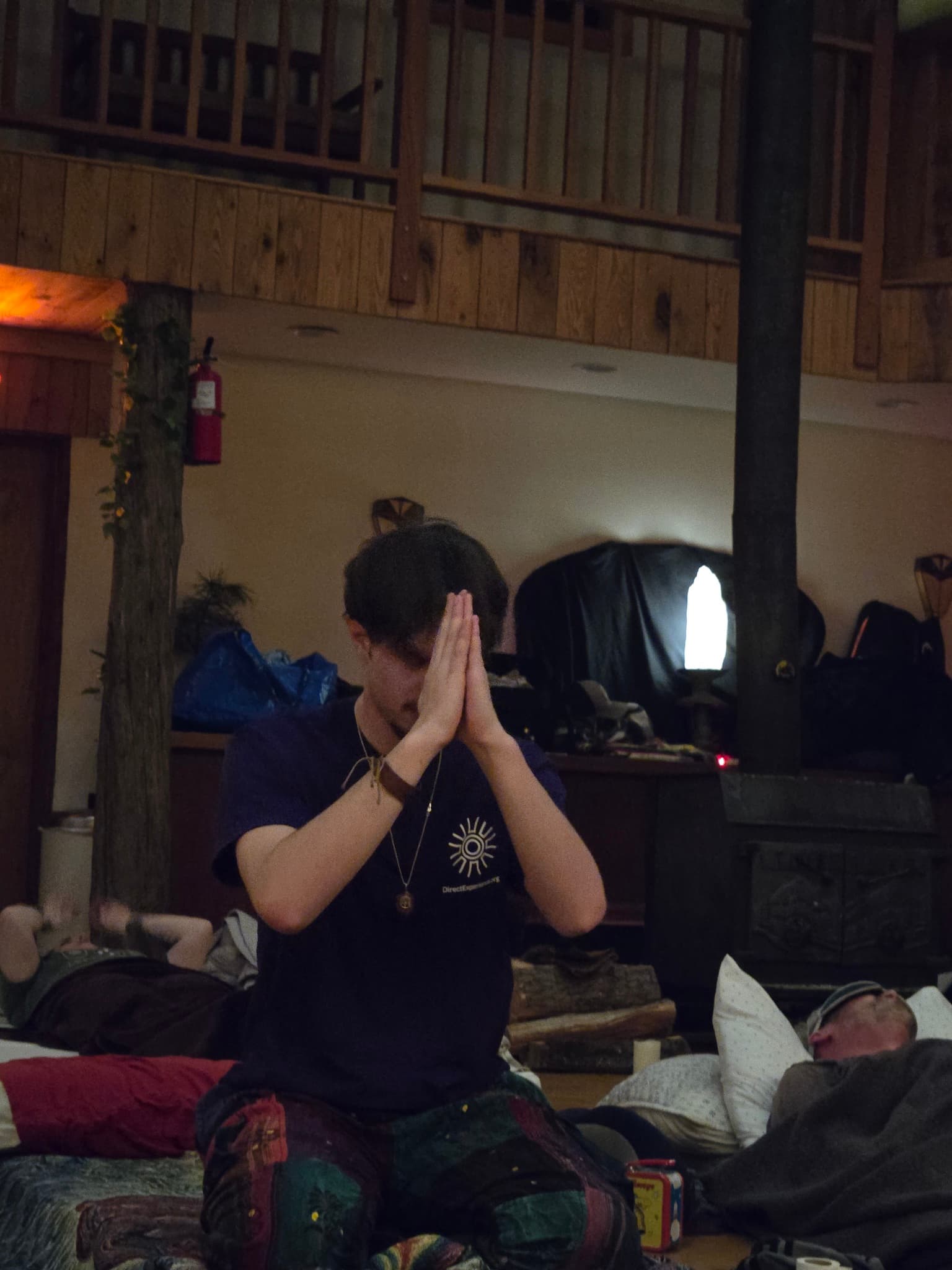 Person in prayer during ceremony